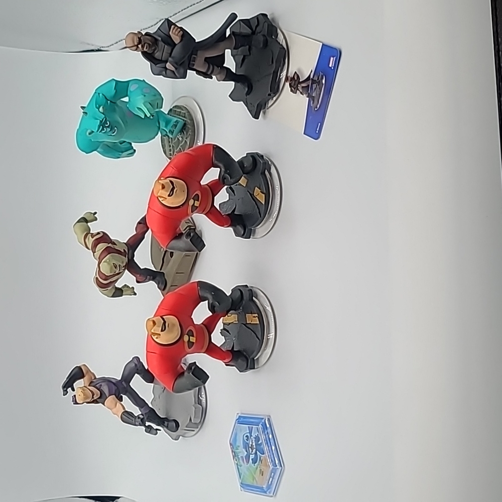 Disney Infinity Characters Nick Fury, Mr. Incredible, Sully and 2 more.